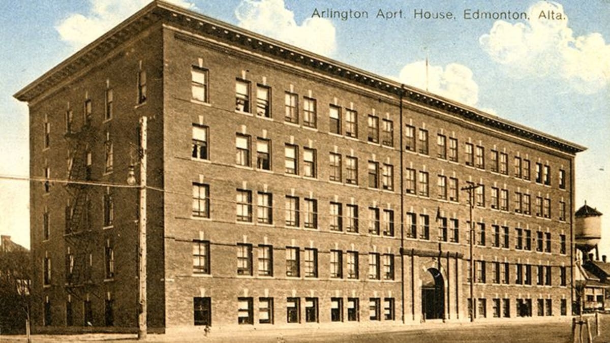 Exterior view of Arlington Apartments, captured in a historical photograph.
